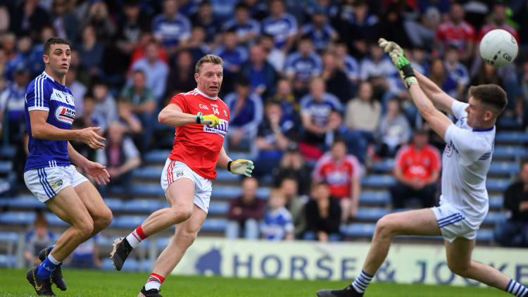Brian Hurley of Cork scores his second goal past Laois goalkeeper Graham Brody during the GAA Football All-Ireland Senior Championship Round 4 match between Cork and Laois at Semple Stadium in Thurles, Tipperary.