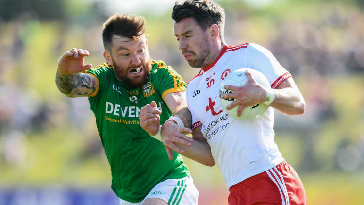 Mickey Burke, Meath, and Mattie Donnelly, Tyrone, in action at Pairc Tailteann, Navan.