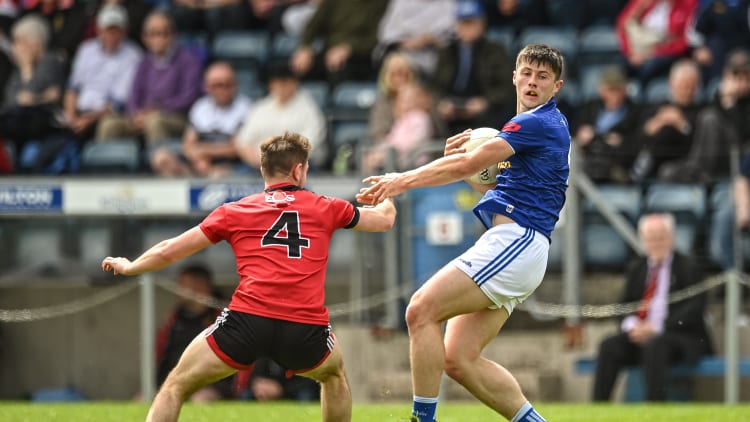 James Smith of Cavan in action against Adam Lynch of Down during the Tailteann Cup Round 1 match between Cavan and Down at Kingspan Breffni in Cavan.