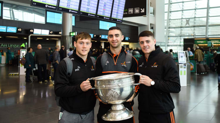 Dublin players, from left, Con O'Callaghan, James McCarthy and Brian Howard with the Sam Maguire Cup at Dublin Airport prior to their departure to the PwC All Stars tour in Philadelphia, USA.