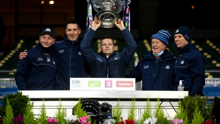 Dublin manager Dessie Farrell, centre, lifts the Sam Maguire Cup with selectors and coaches, from left, Mick Galvin, Brian O'Regan, Shane O'Hanlon and Darren Daly following the GAA Football All-Ireland Senior Championship Final match between Dublin and Mayo at Croke Park in Dublin.