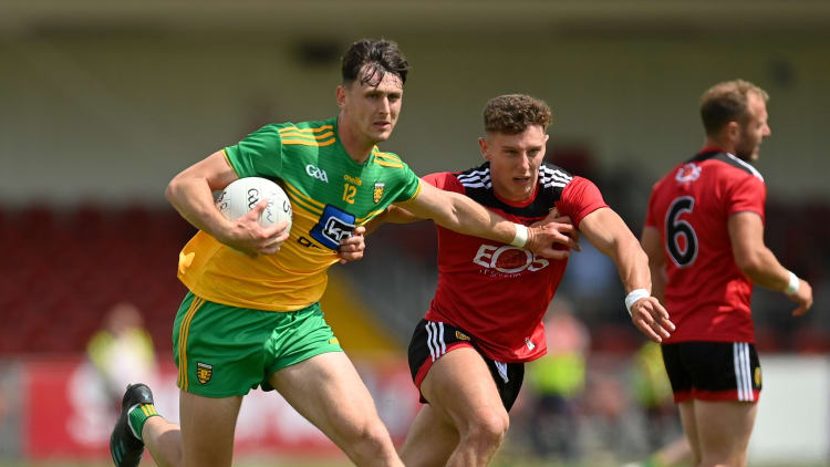 Michael Langan of Donegal in action against Pierce Laverty of Down during the Ulster GAA Football Senior Championship Preliminary Round match between Down and Donegal at Páirc Esler in Newry, Down.