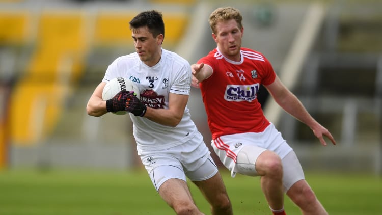 Mick O'Grady of Kildare in action against Rúairí Deane of Cork during the Allianz Football League Division 2 Round 2 match between Cork and Kildare at Páirc Uí Chaoimh in Cork.