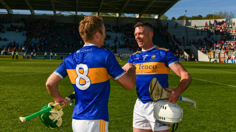 Noel McGrath and Padraic Maher celebrate following Tipperary's win at Pairc Ui Chaoimh.