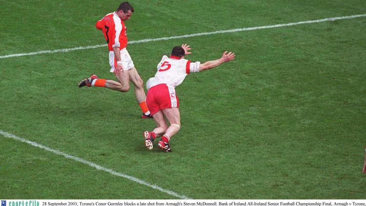 Conor Gormley blocks a Steven McDonnell attempt in the 2003 All Ireland SFC Final.