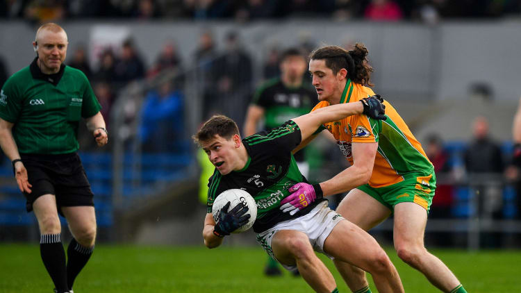 Kevin O'Donovan, Nemo Rangers, and Kieran Molloy, Corofin, during the AIB All Ireland Club Senior Football Championship Semi-Final at Cusack Park.