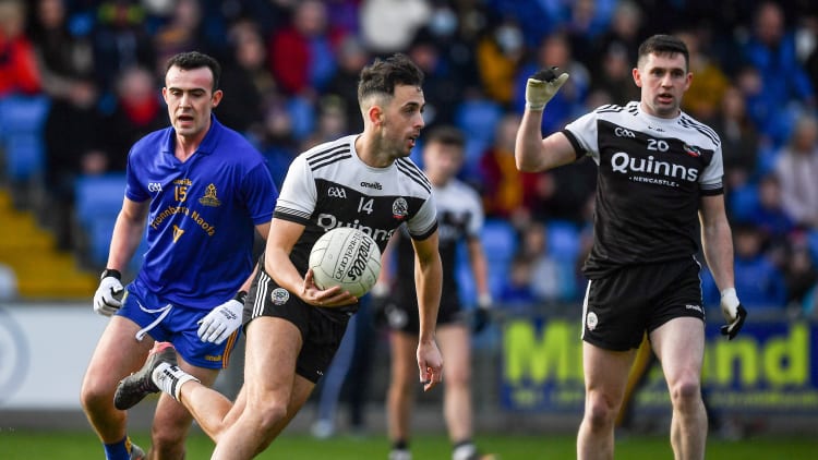 Ryan Johnston, Kilcoo, and Conor McCrickard, St Finbarr's in action at MW Hire O'Moore Park.