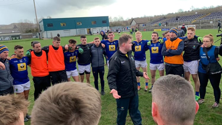 Wicklow manager, Davy Burke, talks to his players after victory over Sligo in Division Four of the Allianz Football League today.
