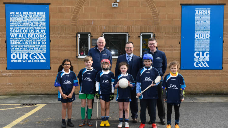 Uachtarán Chumann Lúthchleas Gael John Horan, left, Keith Loughman, Chairman of St Colmcilles GAA Club, and Ard Stiúrthóir of the GAA Tom Ryan, right, with members of St Colmcilles GAA Club, from left, Reva Mehta, age 8, Noah Noone Garland, age 9, Niall O'Donoghue, age 9, Aisling Gillick, age 8, Jack O'Byrne, age 10, and Milena Maza, age 8, at the unveiling of the new GAA manifesto in both Irish and English at St Colmcilles GAA Club in Bettystown, Co Meath.