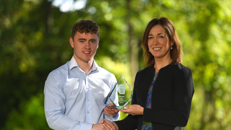Kildare footballer Jimmy Hyland being presented with his EirGrid U20 GAA Football All-Ireland Championship Player of The Year award by Valerie Hedin, External Communications Manager at EirGrid.