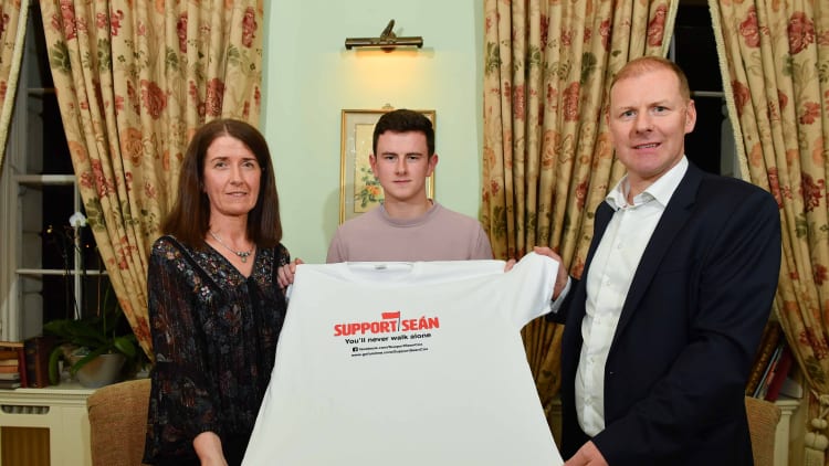 Sean Cox’s wife, Martina, son Jack, and St Peter's, Dunboyne GAA Chairman Fergus McNulty pictured at the launch of Sunday's fundraiser game between Meath and Dublin at Pairc Tailteann.