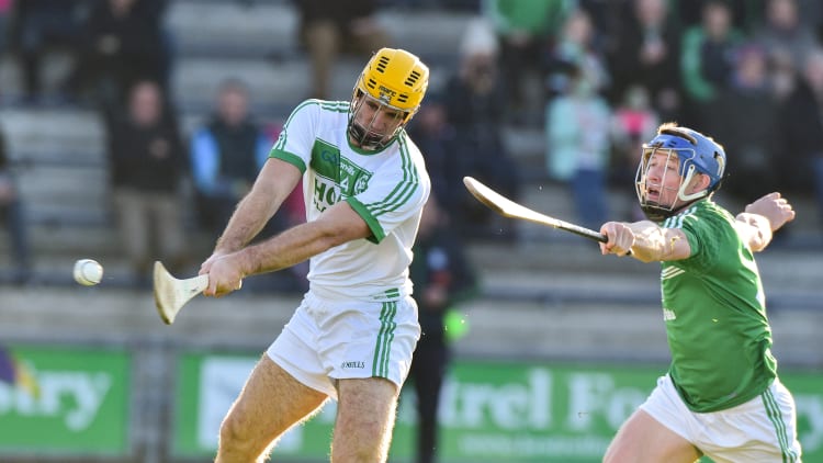 Colin Fennelly of Ballyhale Shamrocks scores his second goal despite the effort of Brendan Travers of Naomh Éanna during the AIB Leinster GAA Hurling Senior Club Championship semi-final.