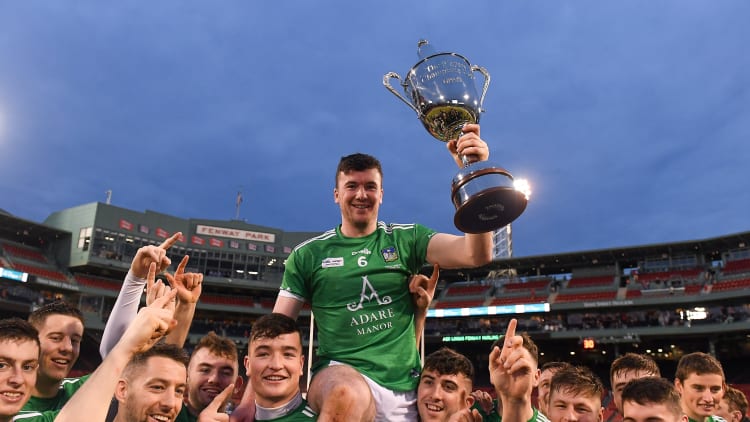 Limerick captain Declan Hannon is held aloft by his team mates as they celebrate with the Players Champions Cup after winning the Aer Lingus Fenway Hurling Classic 2018 Final match between Cork and Limerick at Fenway Park in Boston.
