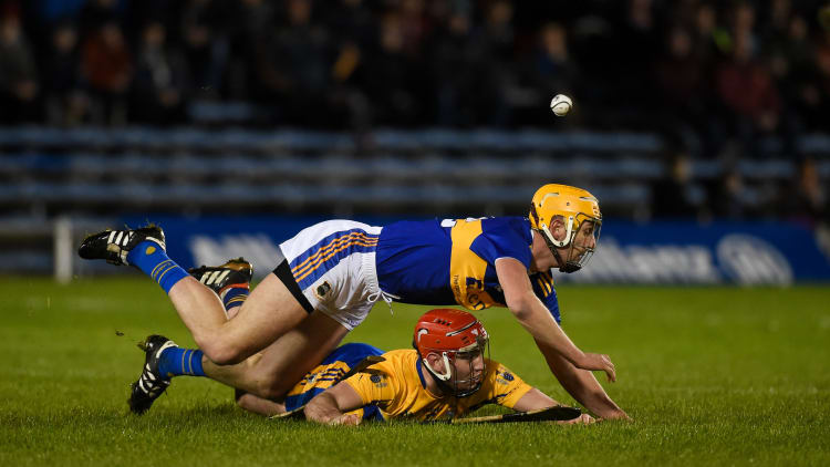 Barry Heffernan, Tipperary, and Niall Deasy, Clare, collide at Semple Stadium.