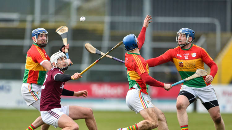 Jason Flynn of Galway in action against Eoin Nolan, Michael Doyle and Seamus Murphy of Carlow during the Allianz Hurling League Division 1B Round 2 match between Carlow and Galway at Netwatch Cullen Park in Carlow.