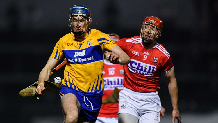 David Fitzgerald, Clare, and Bill Cooper, Cork, in Allianz Hurling League action at Pairc Ui Rinn.