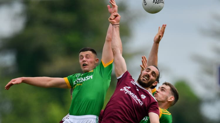 Alan Molloy of Galway in action against Robin Clarke, left, and Sean Claire of Meath during the GAA Football All-Ireland Junior Championship semi-final match between Meath and Galway at Dr Hyde Park in Roscommon.