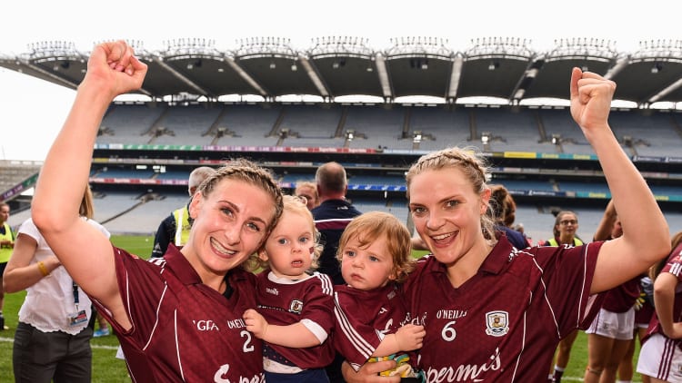Sinéad Burke, left, and Barbara Hannon of Galway, celebrate with Marlee Burke, aged 1, left, and Miko Finnegan, aged 1, following the TG4 All-Ireland Ladies Senior Football Championship Semi-Final match between Galway and Mayo at Croke Park in Dublin.