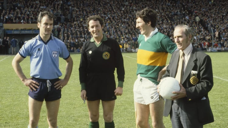 Referee Hugh Duggan with Dublin captain Tony Hanahoe and Kerry captain Tim Kennelly and Frank Hughes, right, holding the match ball before the start of the game.