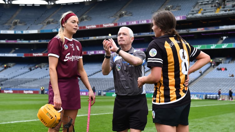 Referee Cathal Egan with team captains Sarah Dervan of Galway and Anna Farrell of Kilkenny before the Littlewoods Ireland Camogie League Division 1 Final match between Kilkenny and Galway at Croke Park in Dublin.