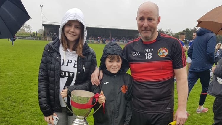 Colin Kelly celebrates with his daughter Tara and son Conal after helping Dreadnots to victory over Naomh Mairtin in the Louth Junior 2B Football Championship Final.
