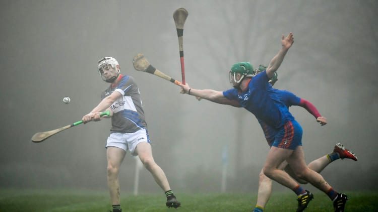 Mickey Mahoney of Waterford IT in action against Tom Barron and Colin O'Brien of Mary Immaculate College during the Fitzgibbon Cup Group A Round 3 match between Mary Immaculate College and Waterford IT at MICL Grounds in Limerick.