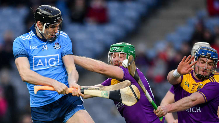 Ronan Hayes, Dublin, gets a shot away despite the efforts of Wexford's Matthew O'Hanlon and Kevin Foley at Croke Park.
