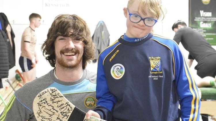 Ailis Malone pictured with Offaly senior hurling Captain Ben Conneely on a visit to Offaly training before the Covid-19 pandemic.