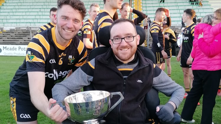 John O'Brien pictured with his brother Stephen (left) and the Mattie McDonnell Cup after Nobber's victory over Trim in the 2019 Meath Intermediate Football Final.