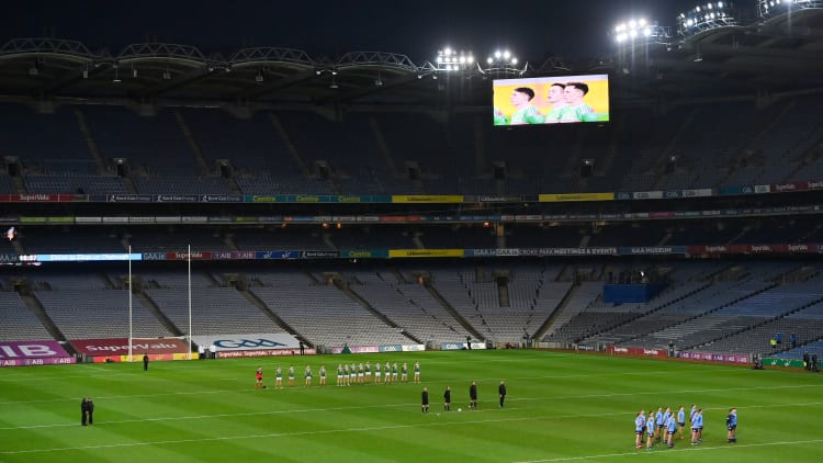 The teams stand for Amhrán na bhFiann in an empty stadium during the GAA Football All-Ireland Senior Championship Final match between Dublin and Mayo at Croke Park in Dublin.