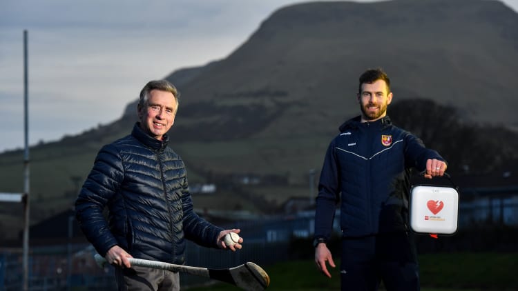 Antrim hurler Neil McManus and his father Hugh at Cushendall GAA Club in Antrim. Neil is an ambassador for the GAA Community Heart Programme which seeks to raise awareness of the benefits of defibrillators to clubs and make it possible to fundraise to acquire them. Neil's work is inspired by his family experience five years ago when his father was saved by the presence of a defibrillator in the community during an emergency. GAA club-based defibrillators have been used to save 42 lives.