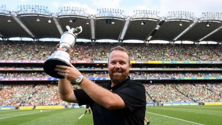 Shane Lowry holds up the Claret Jug in front of a packed house at Croke Park