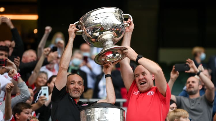 Tyrone joint-managers Brian Dooher, left, and Feargal Logan lift the Sam Maguire Cup following the GAA Football All-Ireland Senior Championship Final match between Mayo and Tyrone at Croke Park in Dublin.