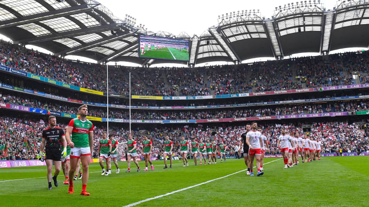 Dublin and Tyrone players parade before the 2021 All-Ireland Football Final. 