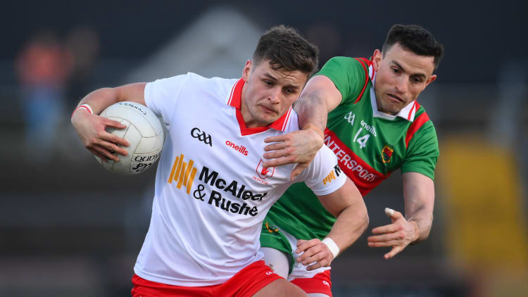 Michael McKernan, Tyrone, and Jason Doherty, Mayo in Allianz Football League action.