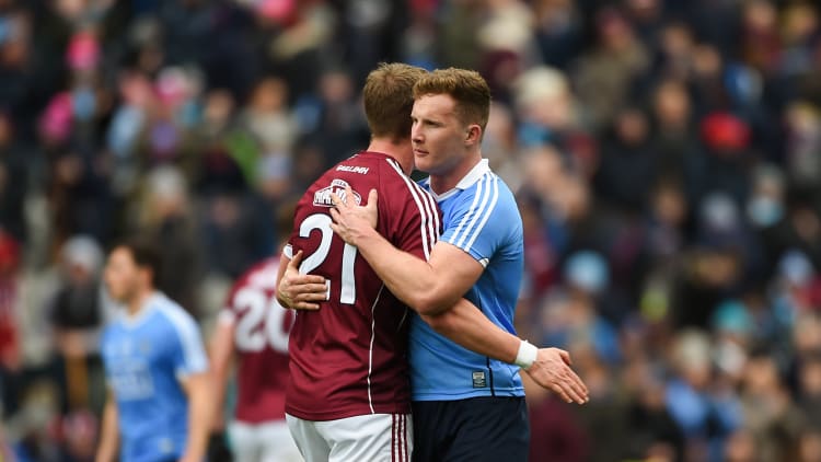 Gary O'Donnell and Ciarán Kilkenny embrace following the Allianz Football League Final.