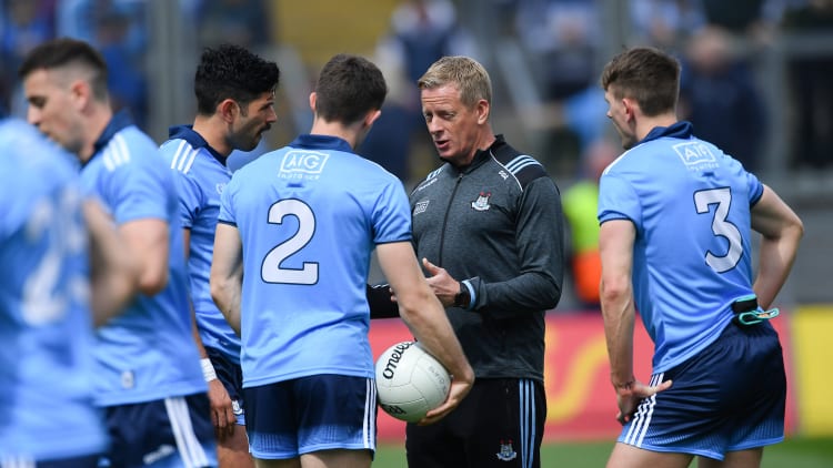 Dublin selector Declan Darcy speaks with players, from left, Cian O'Sullivan, David Byrne, and Michael Fitzsimons before the Leinster GAA Football Senior Championship Semi-Final match between Dublin and Kildare at Croke Park in Dublin.
