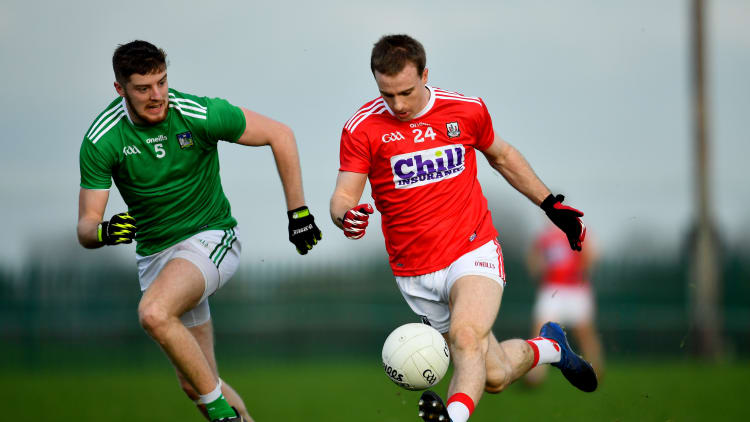 Matthew Taylor, Cork, and Brian Fanning, Limerick, in McGrath Cup action at Rathkeale.