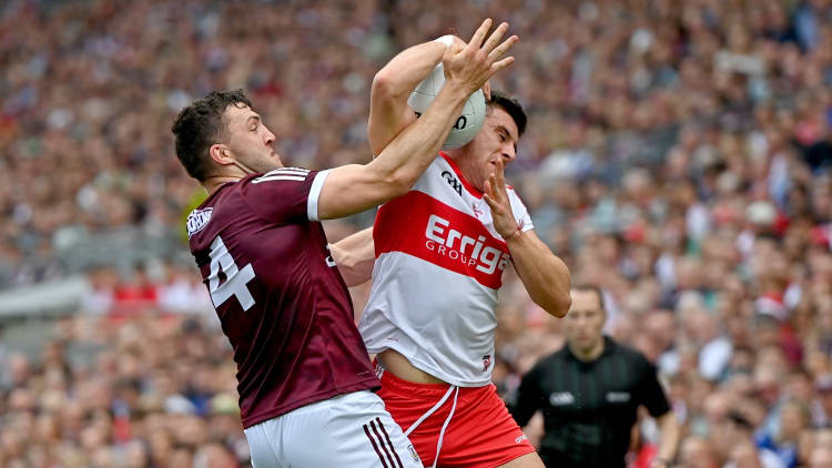 Damien Comer, Galway, and Conor Doherty, Derry, during the All Ireland SFC semi-final at Croke Park.