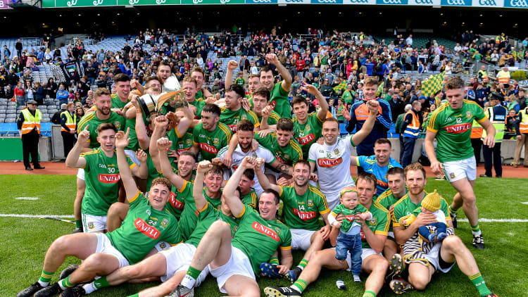 The Meath players celebrate with the Christy Ring Cup after victory over Down.