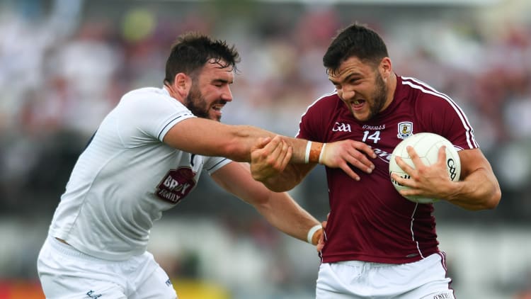 Damien Comer, Galway, and Fergal Conway, Kildare, during the opening period at St Conleth's Park, Newbridge.