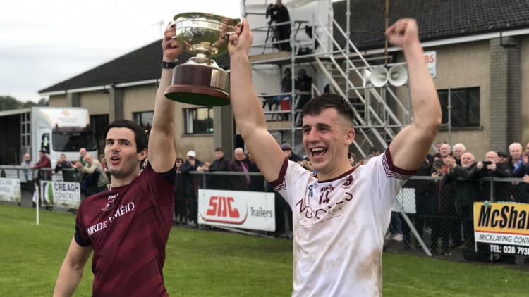 Shane McGuigan (Right) and Karl McKaigue lift the John McLaughlin Cup following Slaughtneil’s victory in today’s O’Neills Derry SFC Final.
