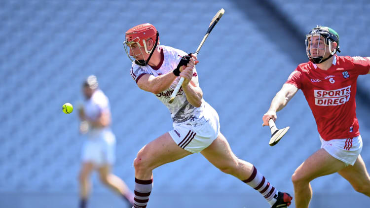 Conor Whelan of Galway scores his side's first goal despite the efforts of Mark Coleman of Cork during the Allianz Hurling League Division 1 Group A Round 5 match between Cork and Galway at Páirc Ui Chaoimh in Cork.