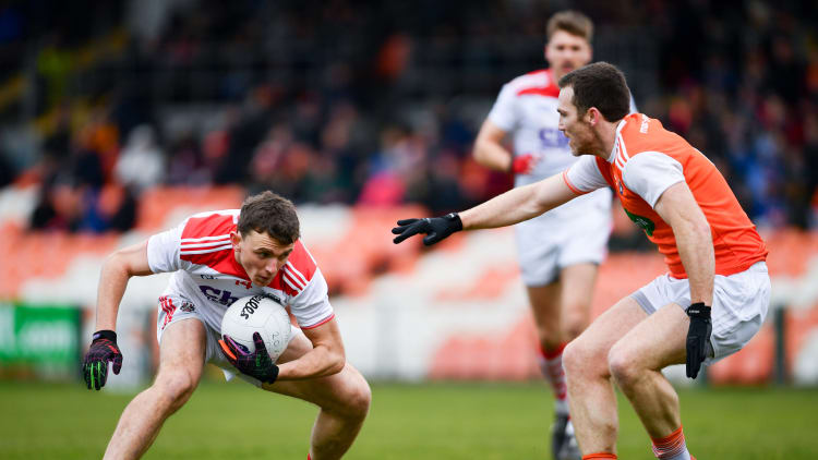 Mark Collins, Cork, and Brendan Donaghy, Armagh, in Allianz Football League action at the Athletic Grounds.