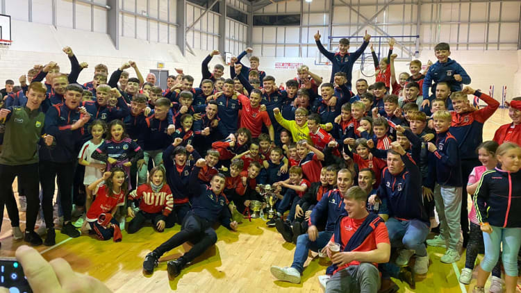 Trim players celebrate after winning senior, minor, and U-13 Meath county titles on the same weekend.