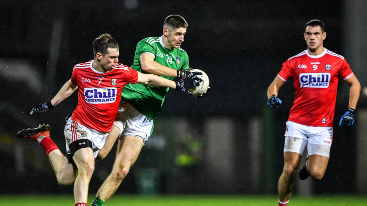 Danny Neville of Limerick in action against Cian Kiely, left, and Thomas Clancy of Cork during the McGrath Cup Final match between Cork and Limerick at LIT Gaelic Grounds in Limerick.