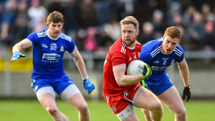 Frank Burns, Tyrone, surrounded by Monaghan's Kieran Duffy and Darren Hughes in Castleblayney.