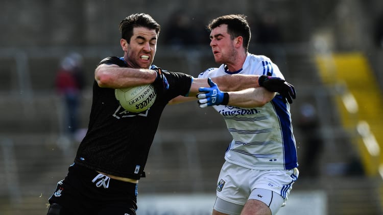 Michael Darragh MacAuley, Dublin, and Conor Rehill, Cavan, in Allianz Football League action at Kingspan Breffni.