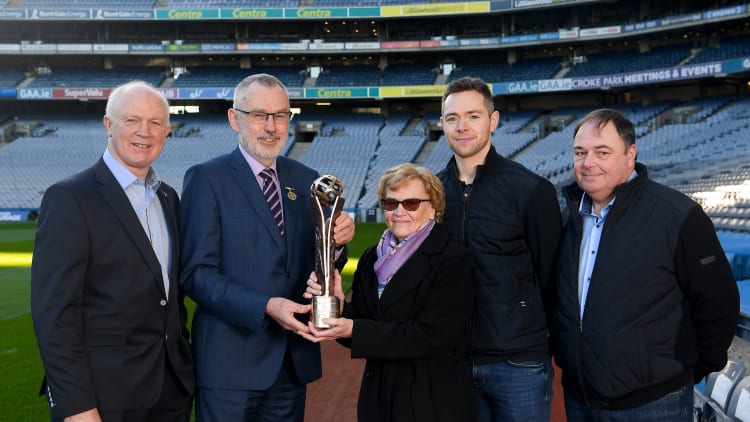 GAA President, Larry McCarthy, presents the Dermot Early family award to the Rock family, left to right, Barney Rock, Betty Rock, Dean Rock, and Joe Rock.
