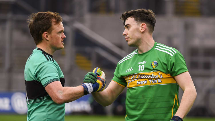 Dean McGovern of Leitrim is consoled by goalkeeper Thomas Mallon of Derry after the Allianz Football League Division 4 Final.